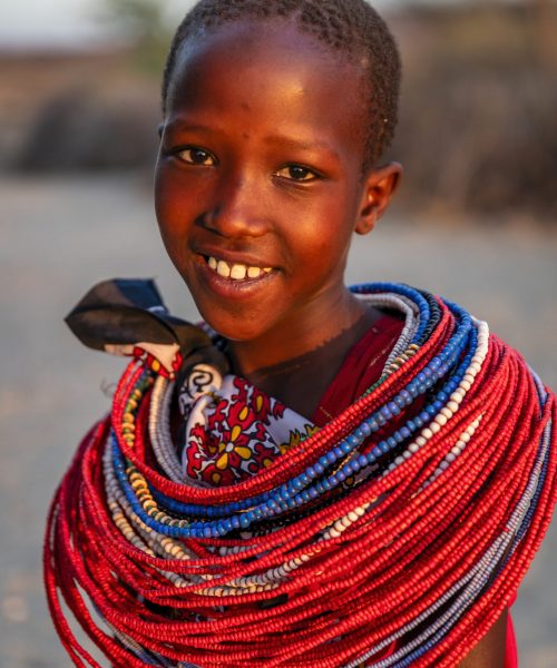 portrait of happy african young girl from samburu tribe, kenya, africa
