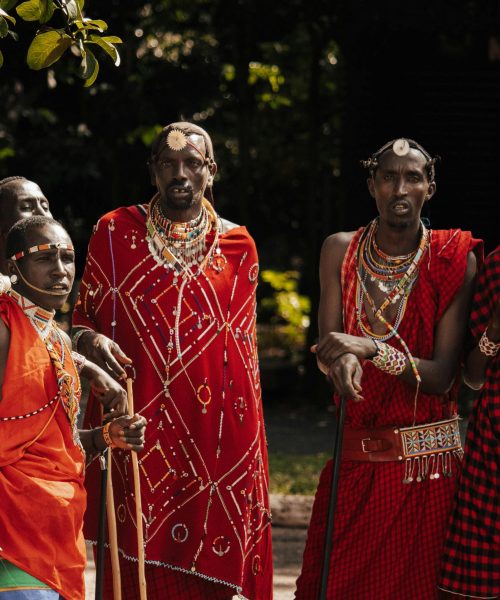 Maasai dancers in traditional attire performing in Nairobi, Kenya. Vibrant cultural expression.